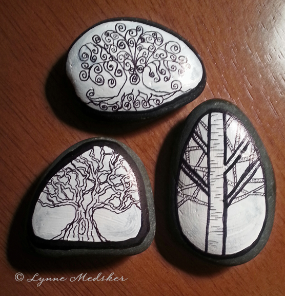 Trees painted on stones © Lynne Medsker